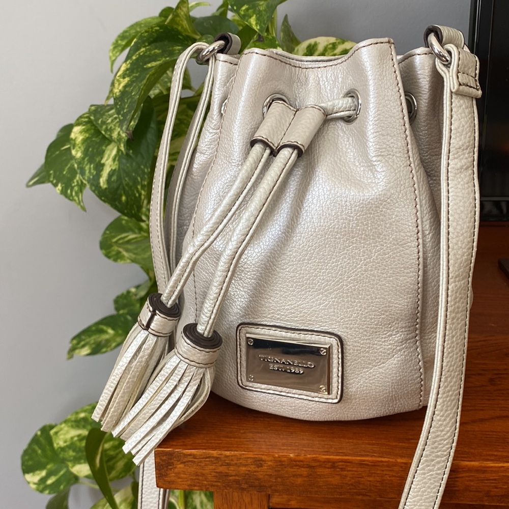 Tignanello leather crossbody purse with tassels.